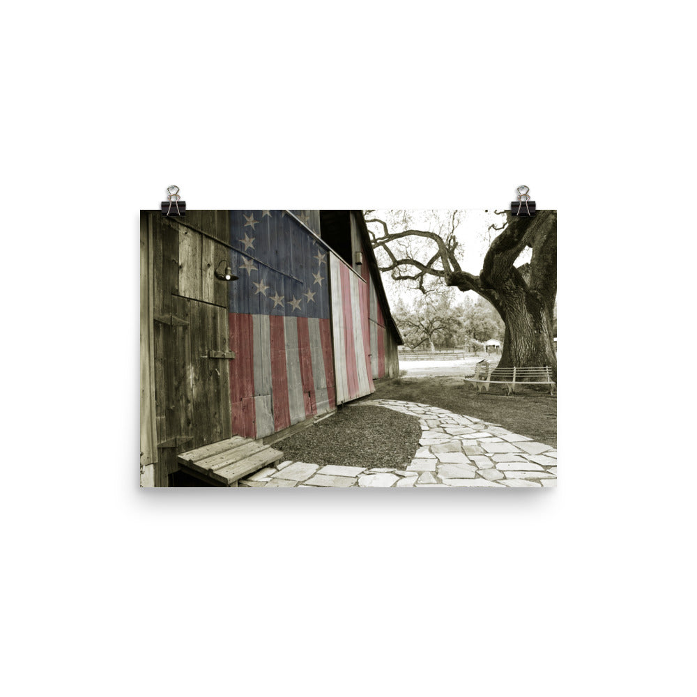 Image of Rustic Barn 12 inch by 18 inch art print illustrating an American flag painted on the wooden slats of an old barn